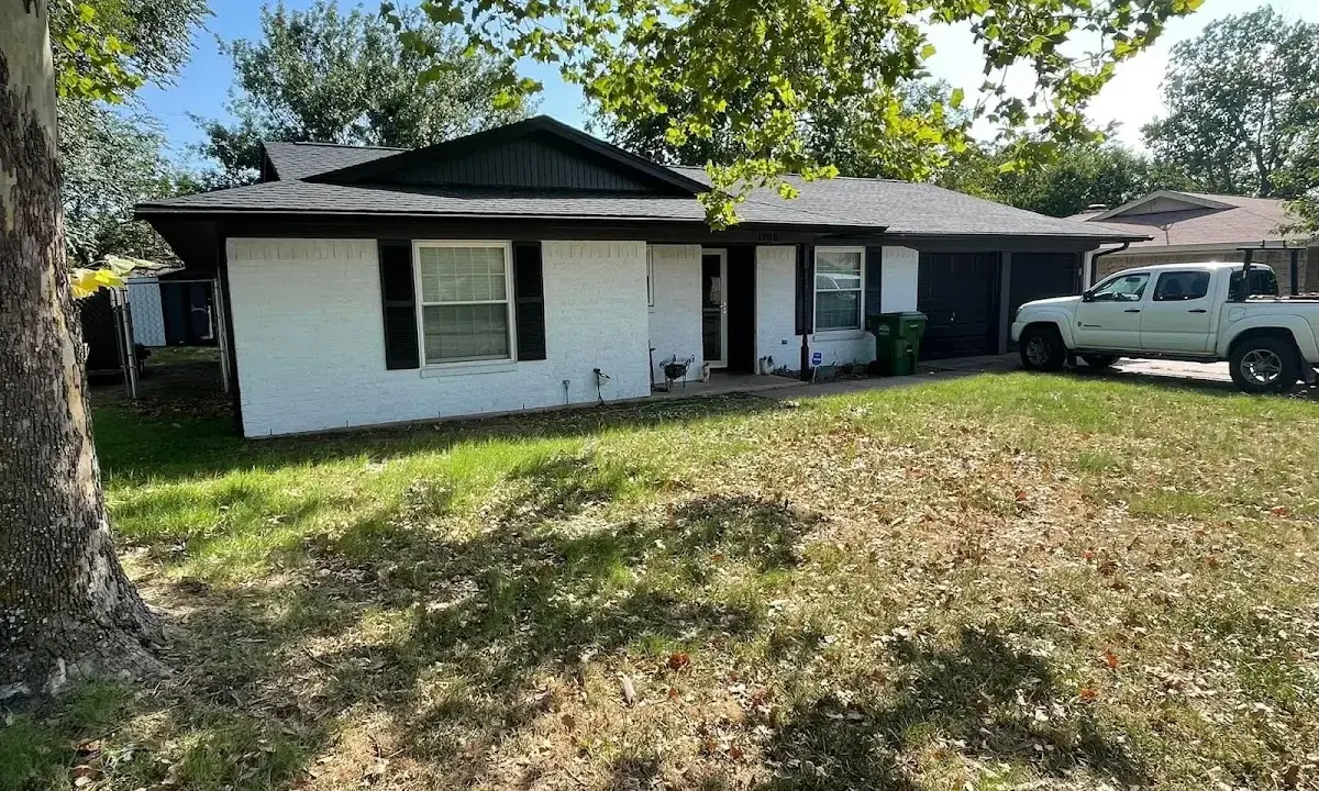 Professional roofing crew working on a residential roof in Mayville